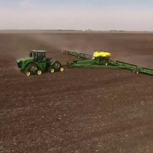 40-yard dash near New Berlin in Sangamon County, IL. John Deere DB120 planting 48 rows of soybeans behind a 9RX tractor. | Sloan Implement Co