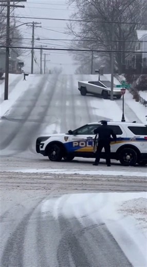 😱 Bystander catches INSANE black ice chaos on steep snowy hill in Ohio: Tesla Cybertruck slides down unable to stop, tires spinning drifting sideways, CRASHES moderate speed into stopped police car with loud metal scrape and crunch, pushing it on the ice while snow sprays everywhere! Officer steps out carefully reacting in surprise 🔥 Black ice just straight OWNED the Cybertruck – real winter traction exposed HARD in 2026 🤣 Police crash or tractor rescue next? Vote below 👇 Police Crash 😂 = L