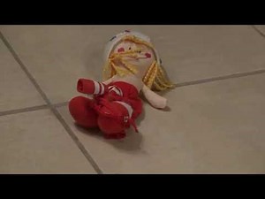 Crushing and tearing of a stuffed animal for children in sti