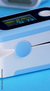 Noninvasive method for monitoring person's oxygen saturation SpO2. Doctor use medical device pulse oximeter probe applied to female finger. Monitoring human health