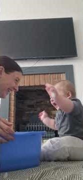 Mother and baby bonding playtime with bubbles in Snodland, England, UK