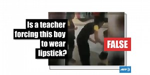 No, this video does not show a boy being forced to wear lipstick
