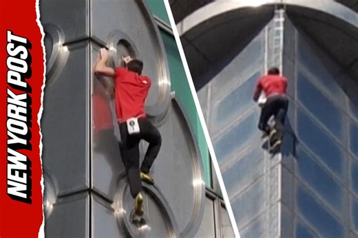 Rock climber Alex Honnold reaches top of Taipei 101 skyscraper without ropes