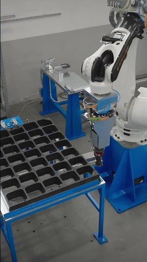 Handling recycled rubber panels with #KawasakiBX #robot #materialhandling #robotics