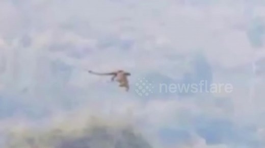Huge “dragon” flies over mountain in the border between China and Laos