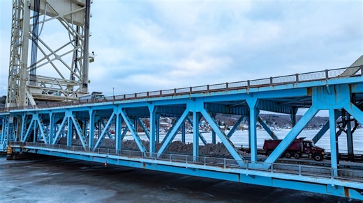 32,400 cubic feet of snow hauled onto U.P. lift bridge for iconic snowmobile crossing