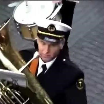Guy pranks marching band with trumpet