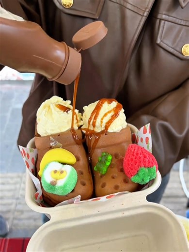 13K views · 214 reactions | Someone’s eating a slipper on the street?! Wait a second—it’s actually an egg waffle! What a wild idea! #StreetFood #FunEats #CreativeSnack | Real Time China | Facebook