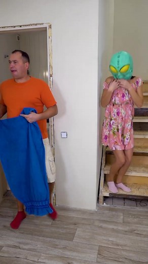 Creative Costume Play Featuring Alien Mask and Towel