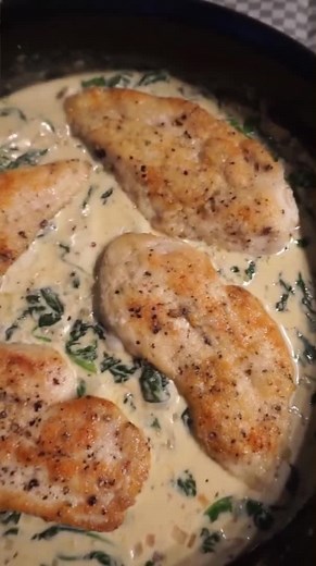 Creamiest lemon chicken with fresh spinach 🍋🧄🌿 How to make: 1. Slice 2 chicken breasts in half (lengthwise) and season with salt and pepper. Coat all sides of the chicken with flour. 2. Heat a few glugs of olive oil on medium and add the chicken. Cook until both sides are golden brown (flipping once). Remove chicken from the pan. 3. Add a few more glugs of oil, 1 shallot (diced) and 2 cloves garlic (minced). Cook for two minutes or until fragrant. 4. Add ½ cup chicken broth, ½ cup heavy cream