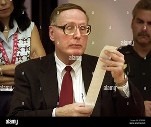 KRT US NEWS STORY SLUGGED: ELN-PRESIDENT KRT PHOTOGRAPH BY DAVID BERGMAN/MIAMI HERALD (FORT LAUDERDALE OUT) (November 14) DELAND, FLORIDA -- Canvassing committee chair Judge Michael McDermott looks over the adding machine tape after the ballots from precinct 305 were run through the counting machine on Tuesday, November 14, 2000 at the Thomas C. Kelly Administration Center near the Volusia County Courthouse in Deland, Florida. There was a discrepancy in the tally that forced a recount. (Photo by