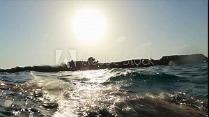 Young swimmer girl practicing freestyle swimming at open sea water slow motion shot