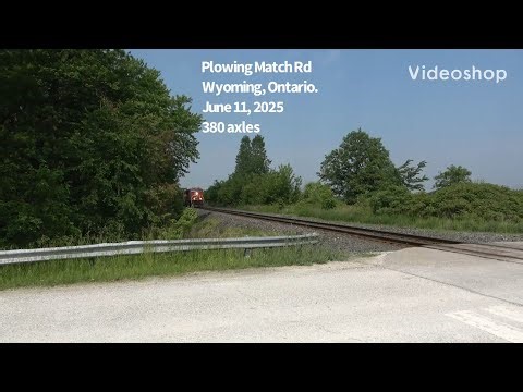 Plowing Match Rd.. CN railway 3173 & 5700 power eastbound stack & rack train.