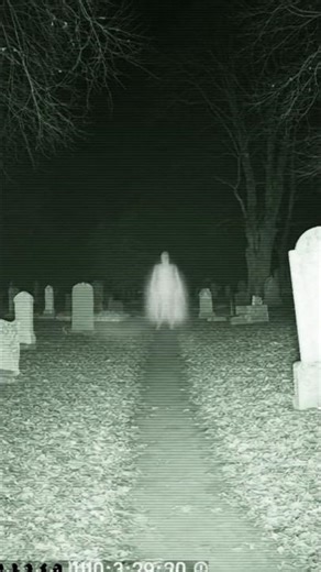 A camera records a translucent white figure appearing in the background and slowly disappearing 😱