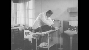 clip-31961659-1940s-united-states-doctor-examines-boy-clinic