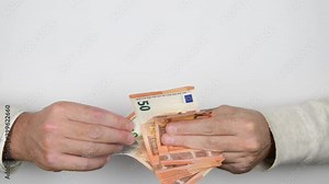4k Close-up of man's hands counting stack of euro paper currency, money cash, financial calculations. Concept of investment, financial success, great earnings, career advancement.