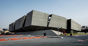 MMA projects uses cement   black glass for sculptural 'axiom telecom' headquarters in dubai