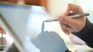Disabled man using graphics tablet for hand motion rehabilitation,digital technology health therapy