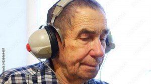 Hearing test. Man with headsets listen to a noise. Occupational health and safety for audiometric testing