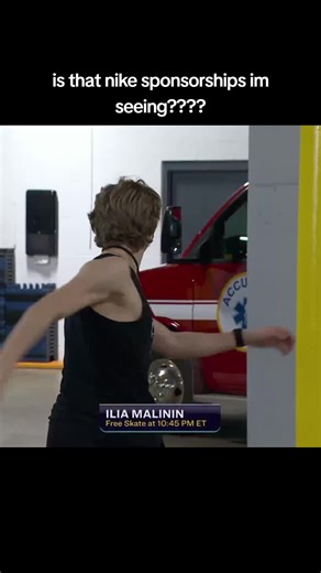nike logo and text in the O zkskak #figureskating #quadgod #iliamalinin #usfigureskating #nike