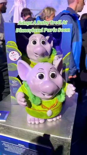 MagicalSoul Foodie on Instagram: "Adopt A Baby Troll At Disneyland Paris coming soon and exclusively at Disneyland Paris. This is a preview of merch at World of Frozen at Disneyland Paris Disney Adventure World opening in March 29, 2026. The cute baby Troll is an animatronic, so smooth and cute, her name is Runa. she lights up, she talks, she blinks and she can interact with other trolls. she is triggered by touch. She also comes with a carrying bag that can be worn as a crossbody bag. and you c
