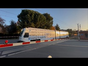 Northbound VTA Green Line Light Rail crosses Kennedy Avenue