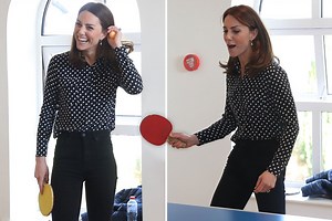 Kate Middleton laughs as she plays ping pong on Ireland tour