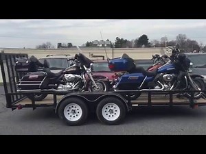 4 Electra Glides on a 16 foot trailer: srkcycles.com