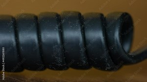 Old telephone cable close up, macro shot. Wire of vintage communication model, telephone set.