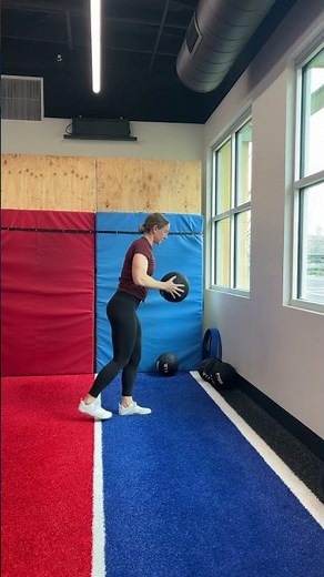 Medicine ball reaching single leg deadlift to target