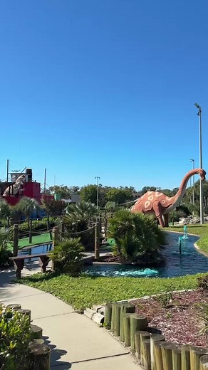 Step into a world where mini golf meets prehistory 🦖⛳️ Professor Hacker's Dinosaur Adventure Golf brings adventure to life in North Myrtle Beach with spacious, immersive courses filled with waterfalls, caves, and life-sized dinos! Grab a deal with The Monster Coupon Book available in the book or on the app 💰 #MyrtleBeach #NorthMyrtleBeach #MiniGolf #ProfessorHacker #DinosaurAdventureGolf #MonsterCouponBook #MyrtleBeachcom #MyrtleBeachThings #FamilyFun #ExploreMyrtleBeach #MyrtleBeachDeals #Put