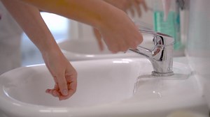 Close up of doctor and nurse washing hands properly in hospital Free Stock Video Footage