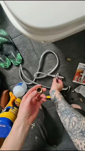 Handyman fitting a bidet
