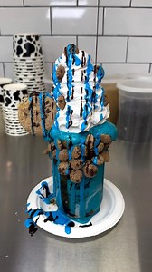 Cookie Monster Milkshake 🤯🍨🍪🥛 Blue Monster ice cream with chocolate & marshmallow drizzles in a chocolate iced jar with Cookie Crisp around the rim. Topped with a cookie dough sandwich, whipped cream, chocolate & blue marshmallow cream drizzles, and Cookie Crisp. 🎥: @foodyfetish . . . #icecream #shake #drizzle #milkshake #cookie #cookiemonster | Ice Cream Bae
