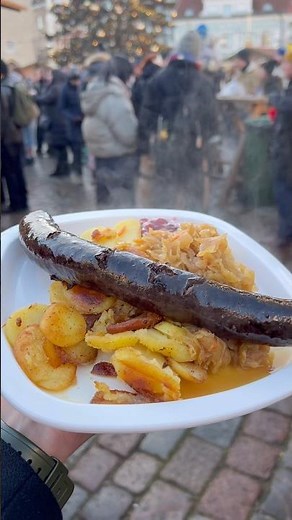 Trying blood sausage at the Tallinn Christmas Market 🍽️