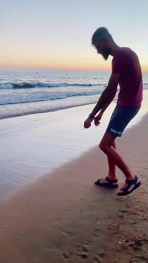 Creating Heart Shapes in the Sand at Sunset Beach