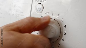 selecting the program and turning on the washing machine Stock Video