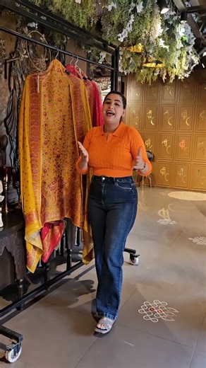 aisha_creations1995 on Instagram: "BOOK YOURS NOW🌸🌸 CATEGORY-SILK COLLECTIONS AE021010100975 *NEW ARRIVALS* Shop our new collections On banarsi brocade. Dense floral jaal in shades of red, pink, orange and green. The motifs are woven kani-style. The fabric is banarsi brocade with soft texture, slight sheen, and fluid drape. The design is Kashmiri-inspired, with rich woven and embroidered detailing. Opada silk bottoms Same as base colour of the dupatta Silk dupatta Very prominent paisley (boteh