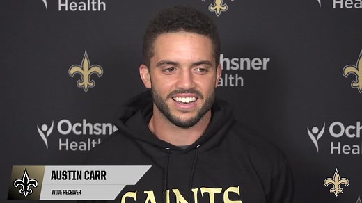 Austin Carr shares experiences with teammates at Saints training camp