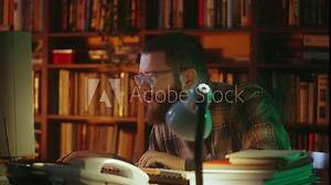 Male office manager working on computer in 90s office, IT specialist, retro