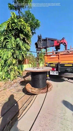 Lifting the Line: How a Crane Unspools Precision in Cabling