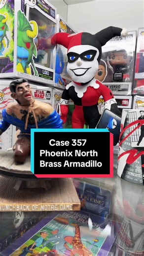 Dealer number 750 has well-stocked, display of collectibles and entertainment memorabilia, in case number 357. The shelves are packed with a variety of treasures, offering a nostalgic trip for fans of pop culture. Action figures and statues, including a Diamond Select Toys Marvel Gallery Doctor Strange PVC figure, capturing the Sorcerer Supreme in a dynamic pose. Also visible is what appears to be a classic Aurora Wolfman model kit, a piece of Universal Monsters history. Other figures like Harle