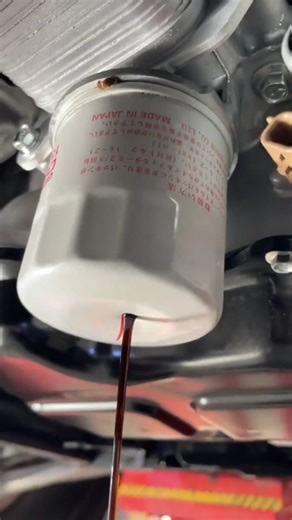 Science, Technology & Engineering | A person uses a screwdriver to remove a stubborn automotive oil filter—a common "last resort" technique when proper tools like an oil... | Instagram