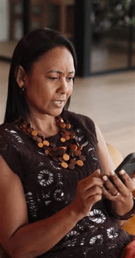 clip-4007528813-confused-phone-surprise-woman-home-living-room