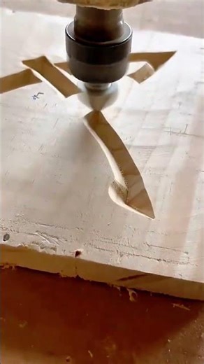 cutting a thick natural wood log using a large industrial band saw machine in a woodworking shop