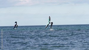 Modern water sport. Hydrofoil ride on the ocean using the wing and the power of the wind. the best place for kitesurfers, video of fit athlete practise hydro foil wing surfing Stock Video