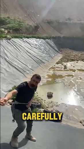 Man climbs down abandoned pond to save a dying dog ❤️ #shorts