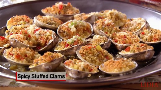 Everyone loves Baked Clams and here is my favorite recipe - plus I'll show you a simple way to open the clams for stuffing. These are best served hot out of the oven, so I always tell my eager guests to go slowly. Buon Gusto! #LidiasRecipes #LidiasItaly #LidiasKitchen #LidiaBastianich #ItalianFood #LidiasTheArtofPasta #LidiasOliveOil https://lidiasitaly.com/recipes/spicy-stuffed-clams/ Great with - https://youtu.be/XvPgzVPVGL8 | Lidia Bastianich