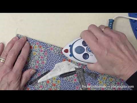 The Small and Powerful Dritz Mighty Steam Iron and Silicone Iron Rest