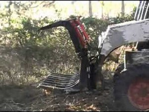 72" skid steer grapple root rake cleaning up some brush